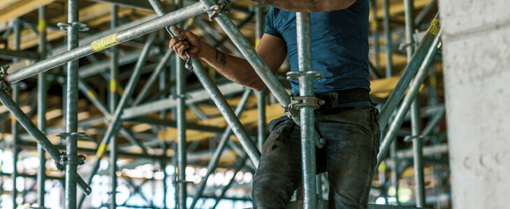 Construction worker on a high scaffolding