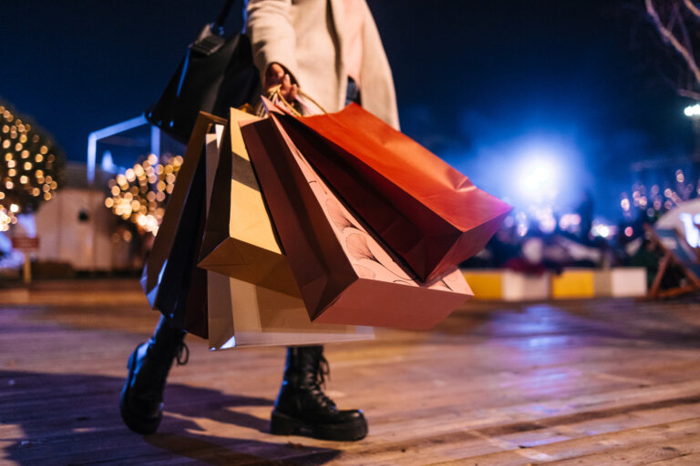 Woman walking with shopping bags