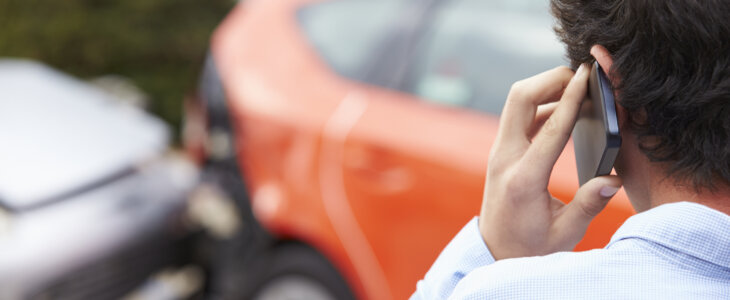 Teenage Driver Making Phone Call After Traffic Accident